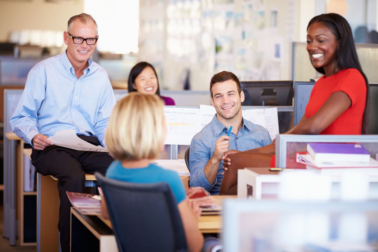 office team having a fun conversation at work